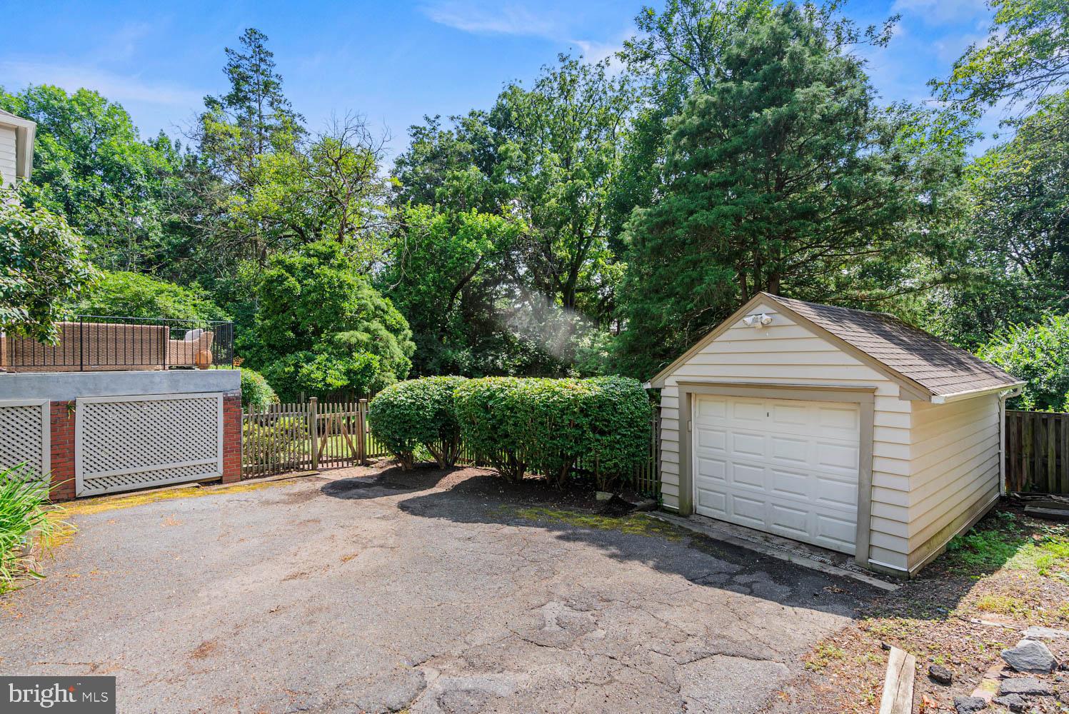 7406 Brookville Road Chevy Chase, MD 20815 - Photo 62 of 72 a view of a small house with a small yard and large tree