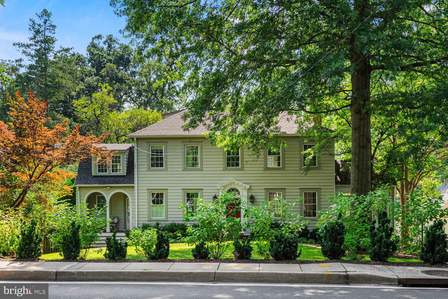 7406 Brookville Road Chevy Chase, MD 20815 - Photo 63 of 72 a front view of a house with a yard