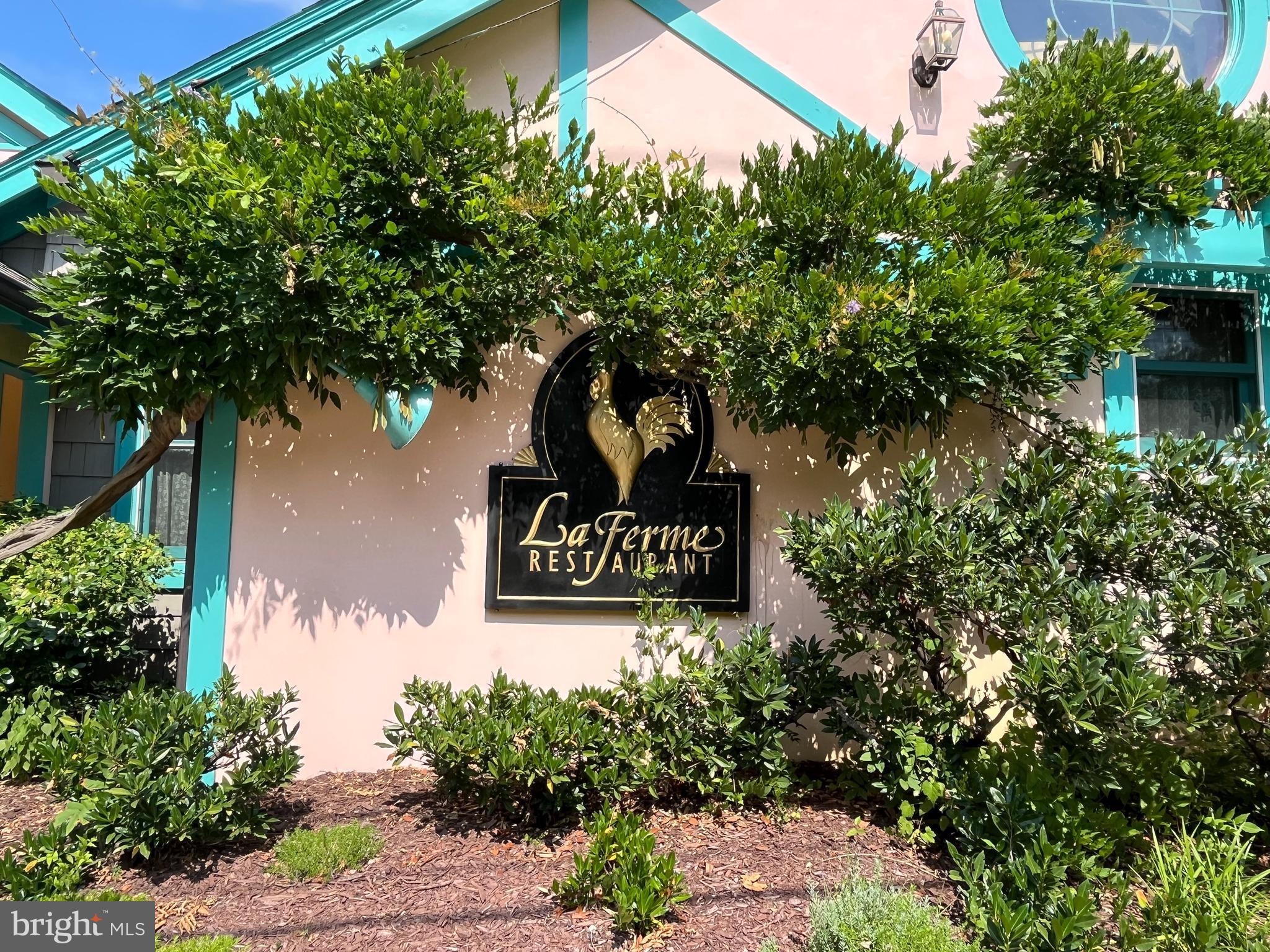 7406 Brookville Road Chevy Chase, MD 20815 - Photo 68 of 72 a sign that is sitting on a brick wall