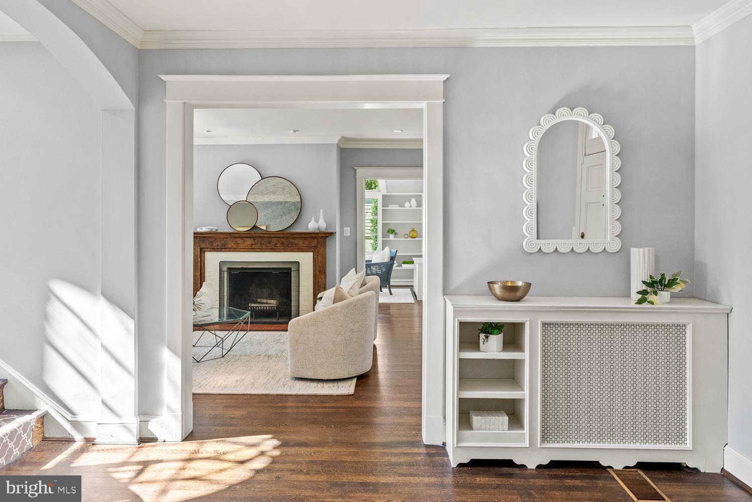 7406 Brookville Road Chevy Chase, MD 20815 - Photo 9 of 72 a living room with furniture and a fireplace
