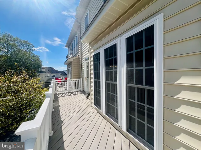 a balcony with view of living room