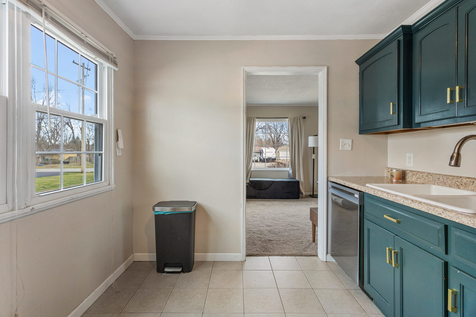 1351 West Pershing Road Decatur, IL 62526 - Photo 12 of 24 a kitchen with a sink and a cabinet