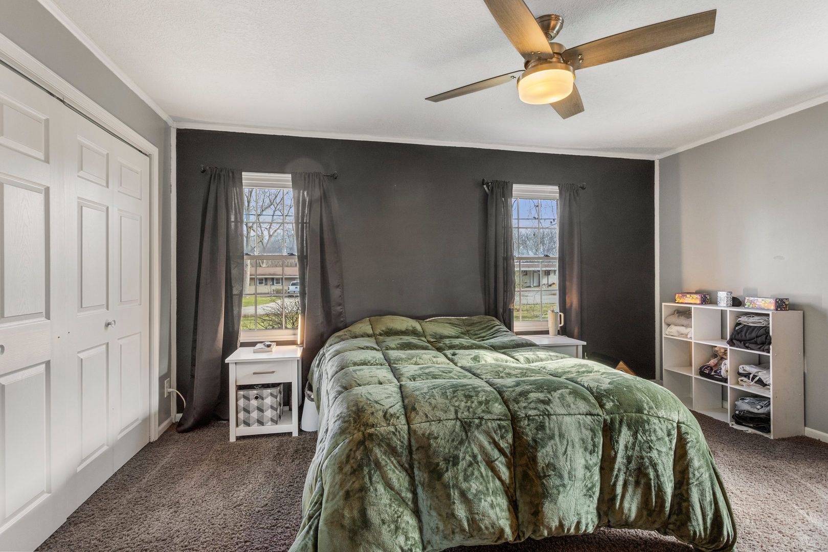 1351 West Pershing Road Decatur, IL 62526 - Photo 13 of 24 a bedroom with a bed and a chandelier