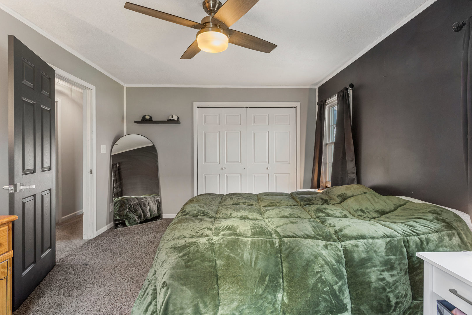 1351 West Pershing Road Decatur, IL 62526 - Photo 14 of 24 a bedroom with a bed and a chandelier