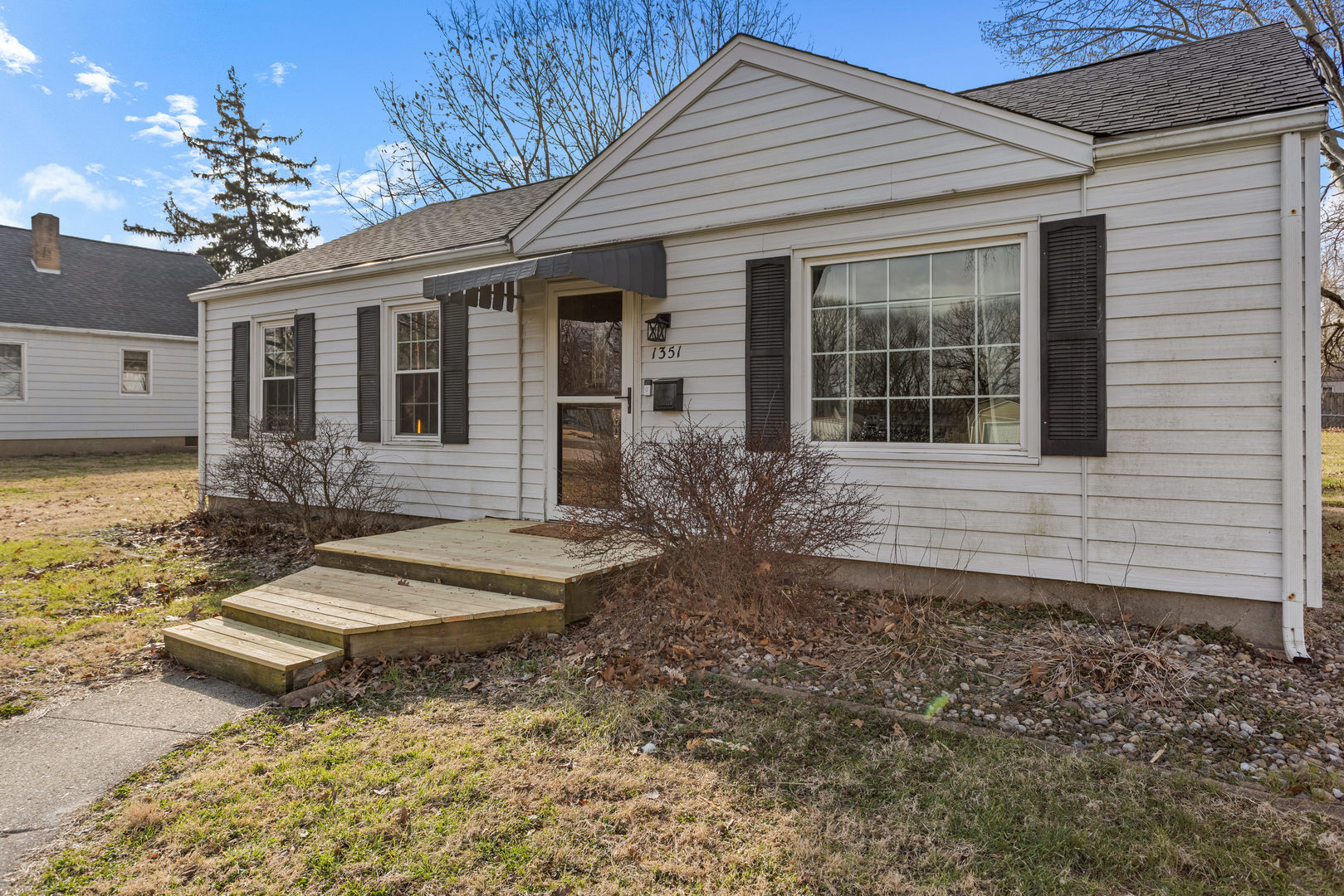 1351 West Pershing Road Decatur, IL 62526 - Photo 4 of 24 a front view of a house with garden