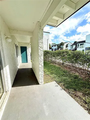 a view of a porch with a yard