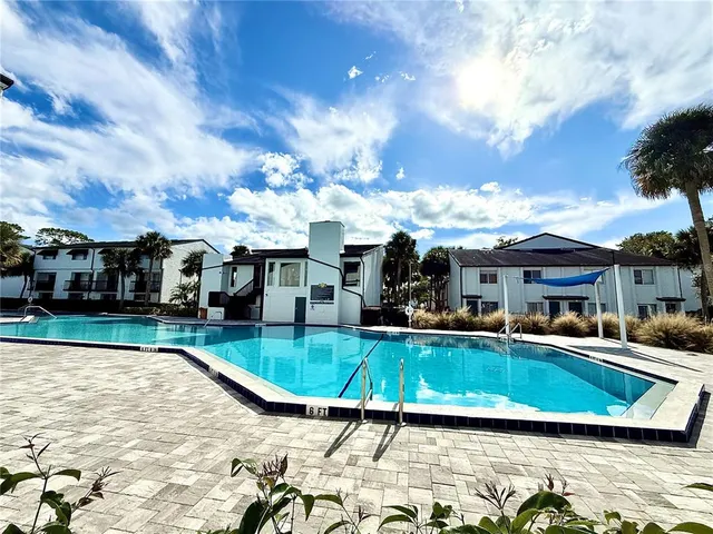 a view of a swimming pool with a patio