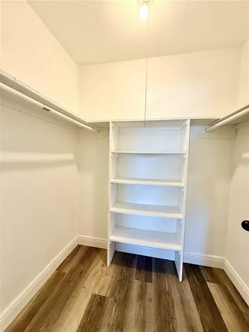 a storage room with wooden floor