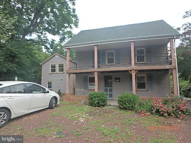 4709 Elmer Derr Road Frederick, MD 21703 - Photo 1 of 10 a view of a house with a cars park side of a road