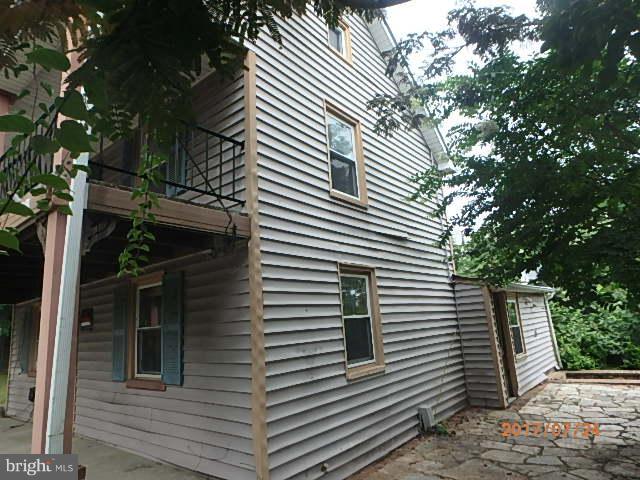 4709 Elmer Derr Road Frederick, MD 21703 - Photo 2 of 10 a view of a house and a tree