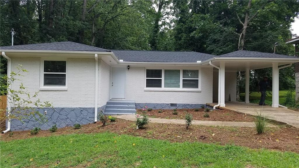 3404 Maplehurst Drive Decatur, GA 30032 - Photo 1 of 1 a front view of a house with a garden