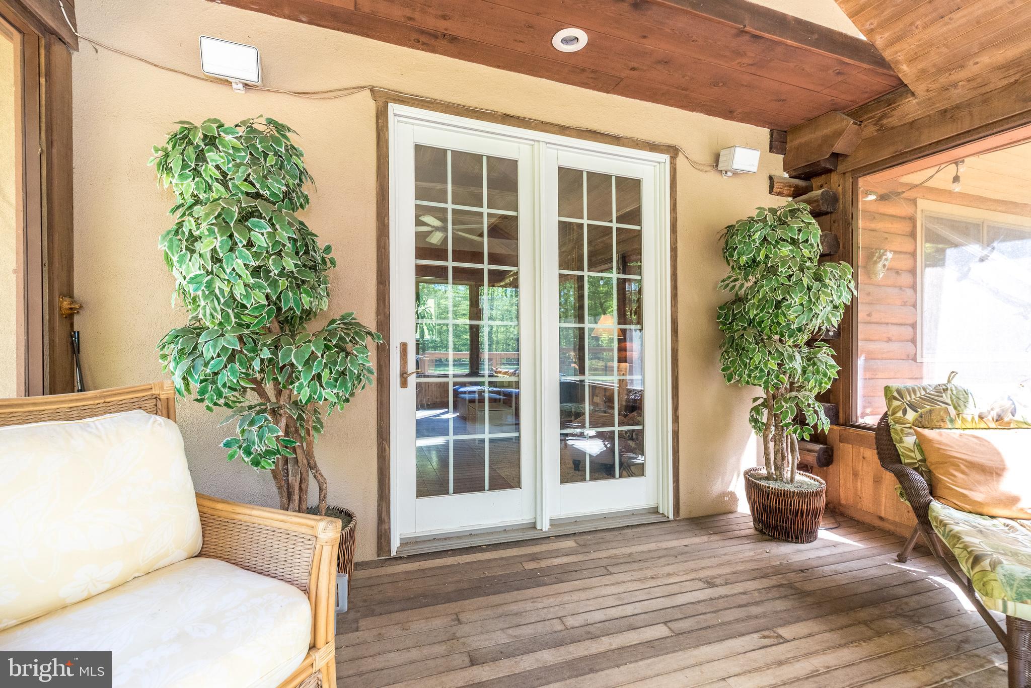 1502 Mission Road Quakertown, PA 18951 - Photo 37 of 52 Double doors to tranquil sunroom