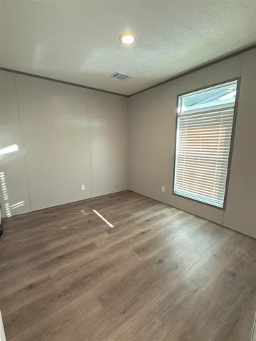 a view of a wooden door with a tree