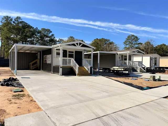 a view of a house with sitting area and view of a house