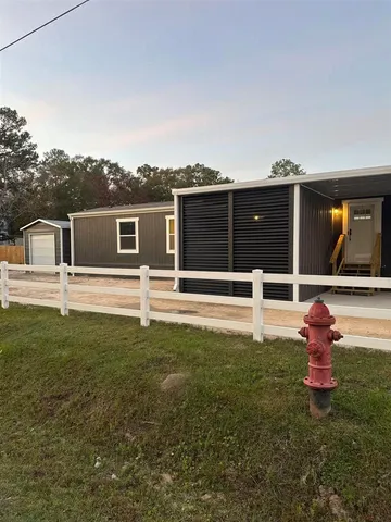 a house view with a garden space