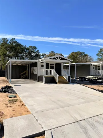a view of a house with a barbeque
