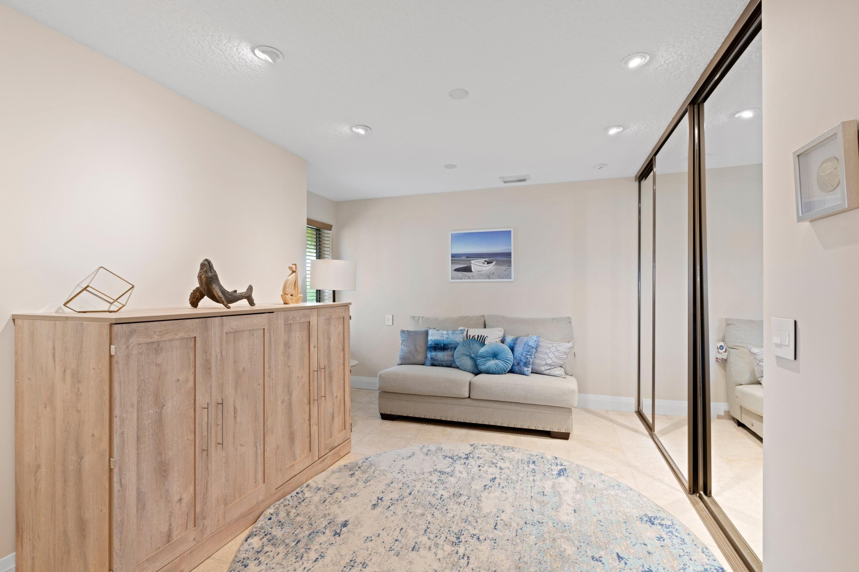 197 Ridge Road Jupiter, FL 33477 - Photo 22 of 44 a living room with furniture and a rug