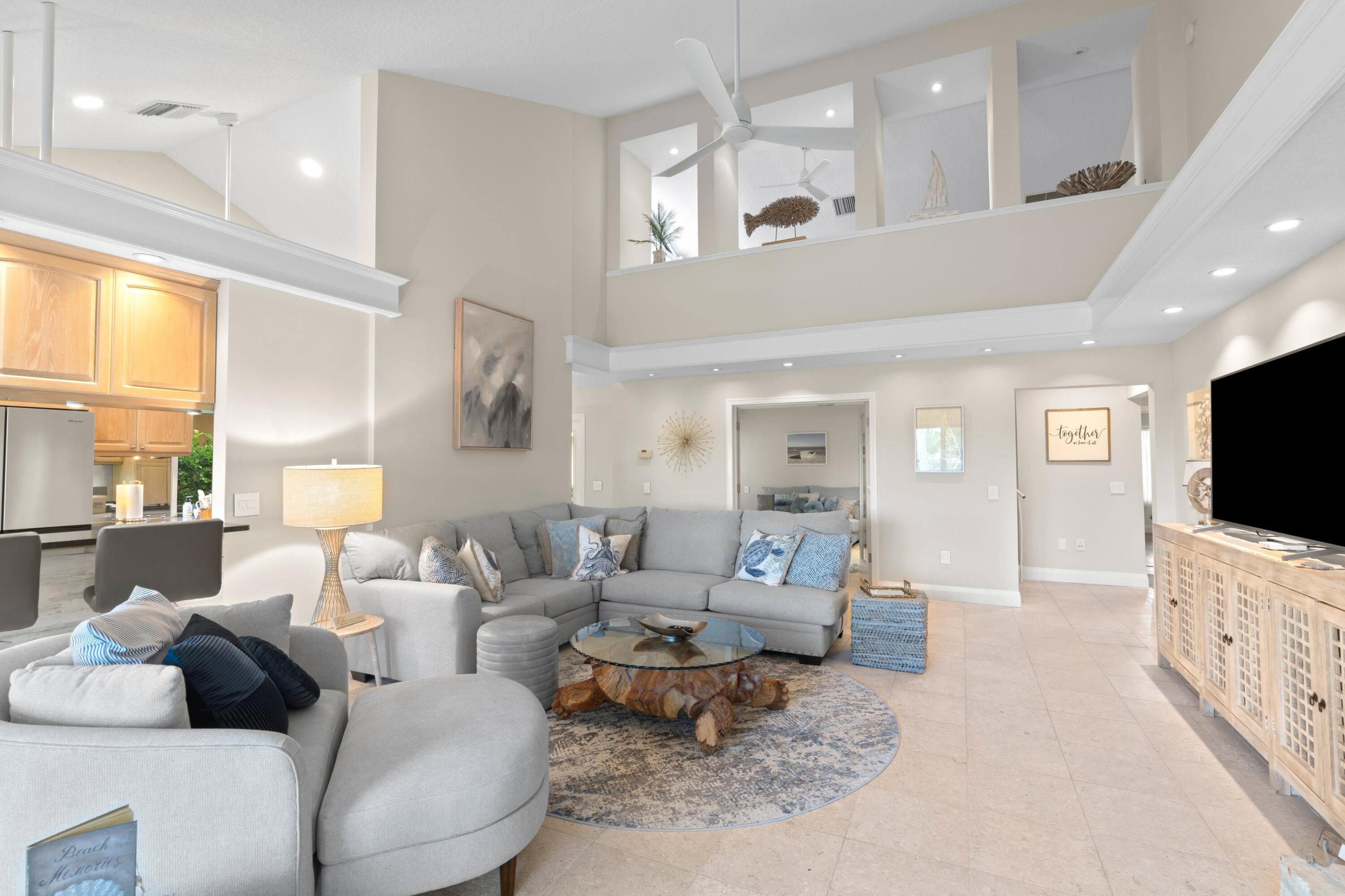 197 Ridge Road Jupiter, FL 33477 - Photo 32 of 44 a living room with furniture and a flat screen tv