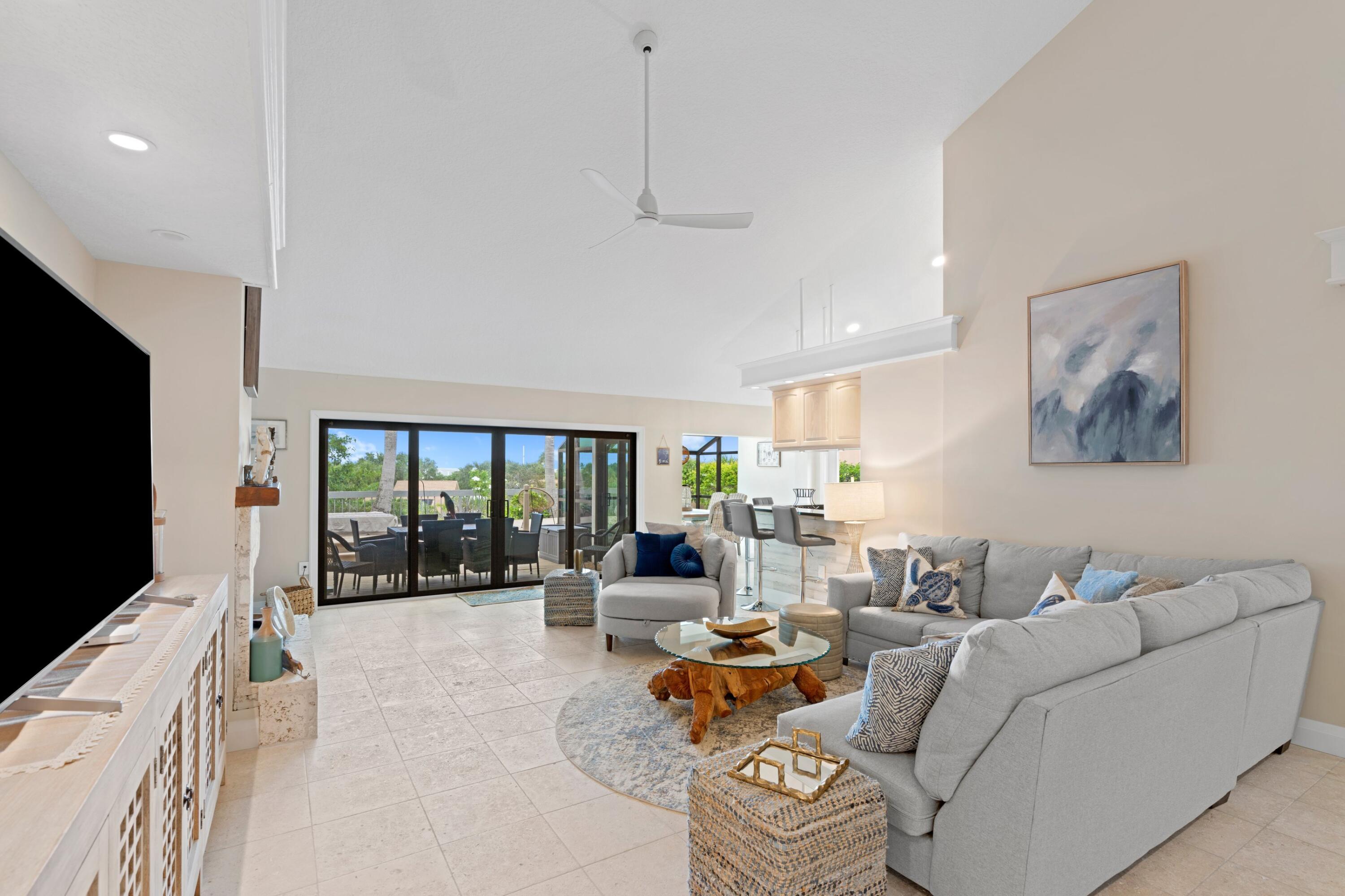 197 Ridge Road Jupiter, FL 33477 - Photo 39 of 44 a living room with furniture and a flat screen tv