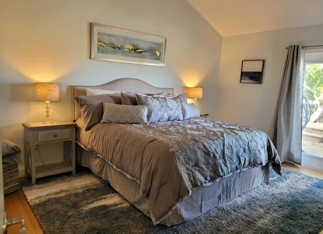 a bedroom with a bed and window