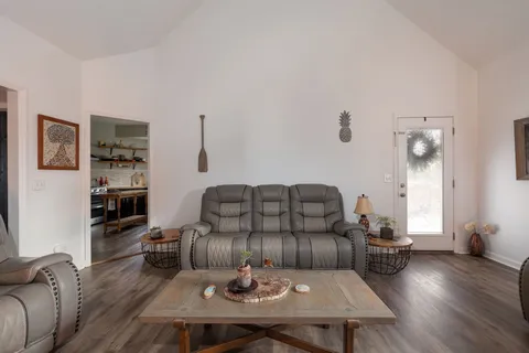 a kitchen with a stove a sink and a refrigerator