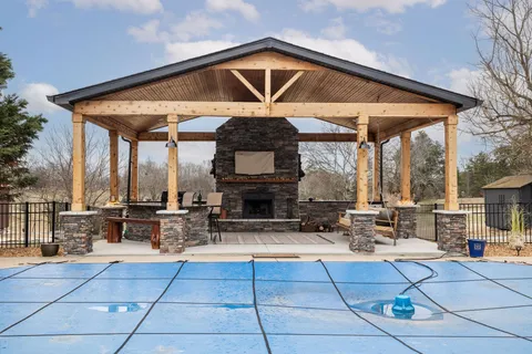 an aerial view of a house with outdoor space