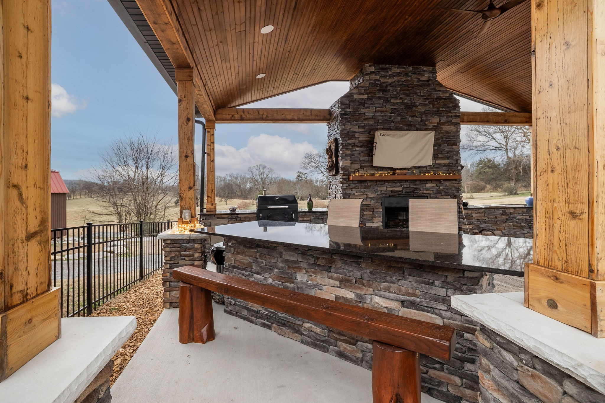95 Old 25 Loop Castalian Springs, TN 37031 - Photo 61 of 93 a living room with furniture a flat screen tv and a floor to ceiling window