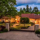 a view of a brick house with a street