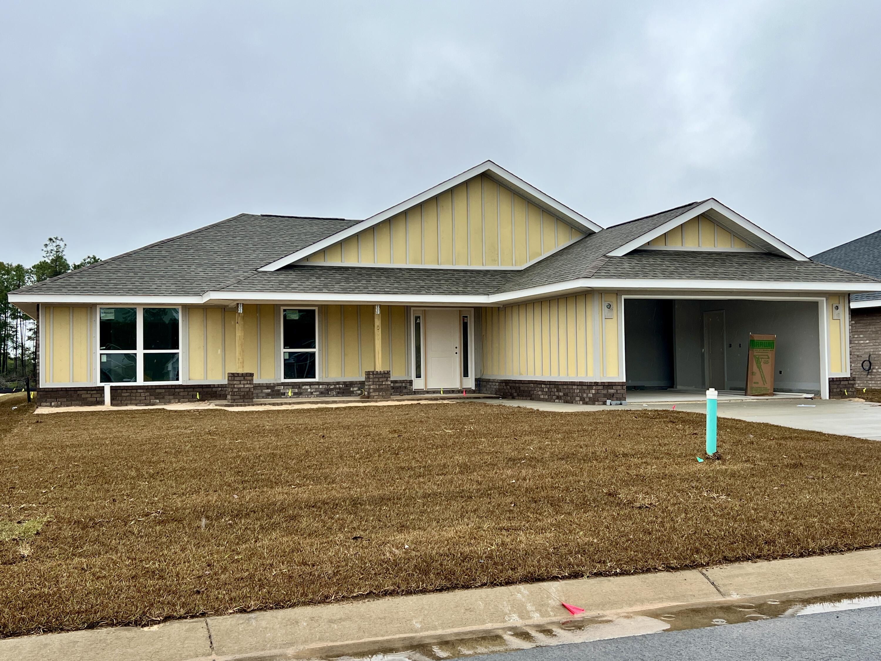 7633 Small Pnes Street Milton, FL 32583 - Photo 2 of 2 front view of a house with a yard