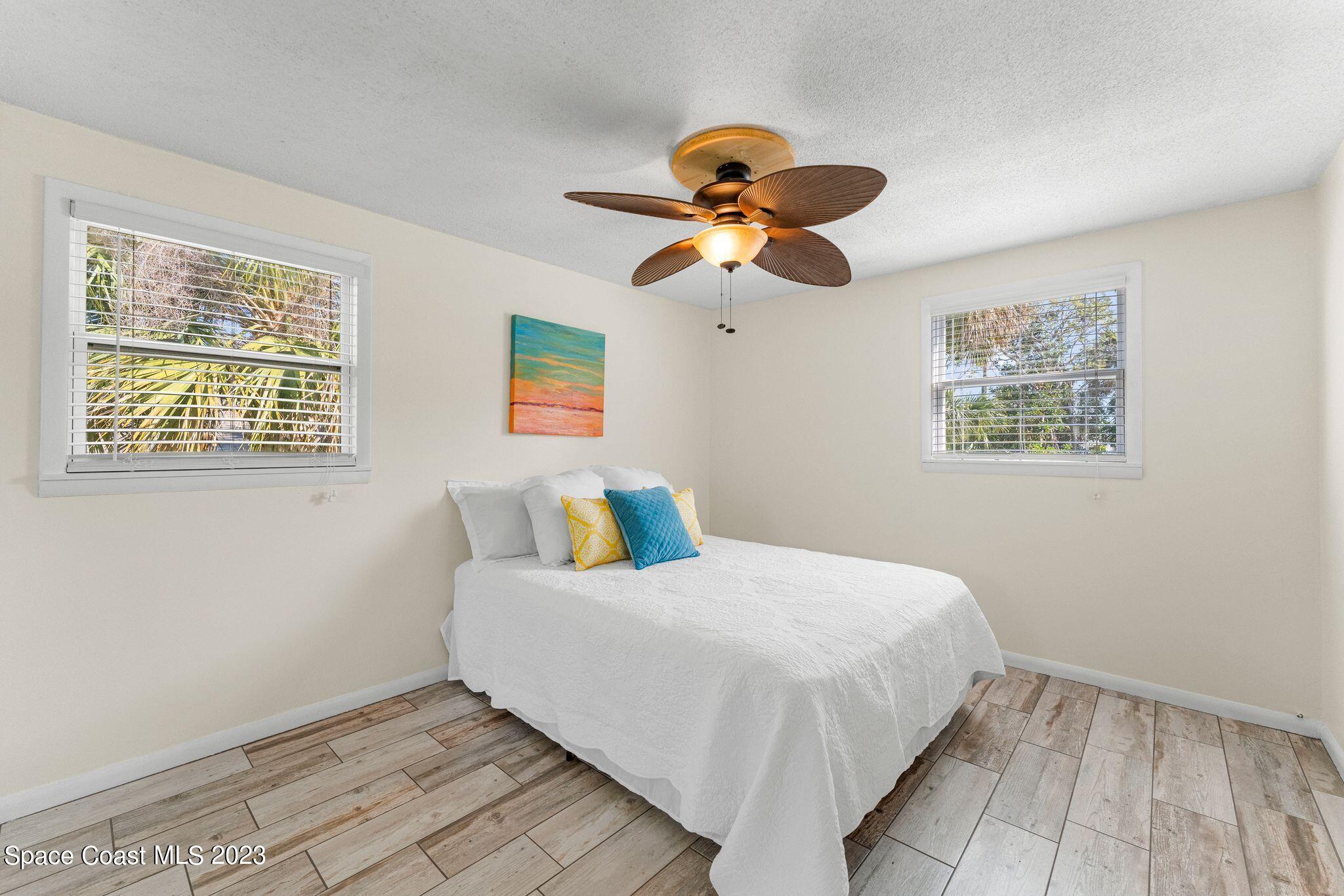 2007 Oak Street Melbourne Beach, FL 32951 - Photo 11 of 26 a bedroom with a bed and a window