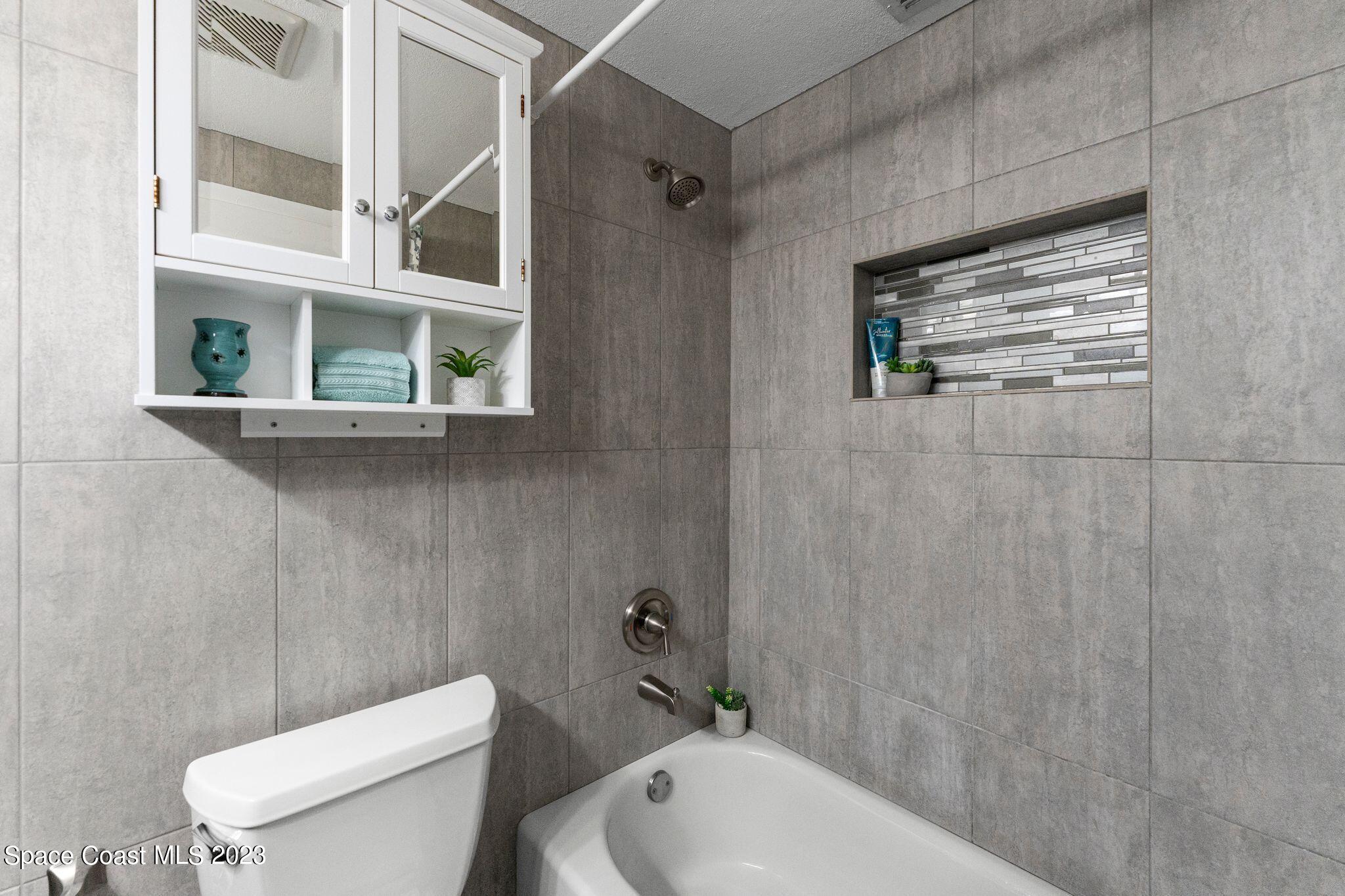 2007 Oak Street Melbourne Beach, FL 32951 - Photo 13 of 26 a bathroom with a toilet and a sink