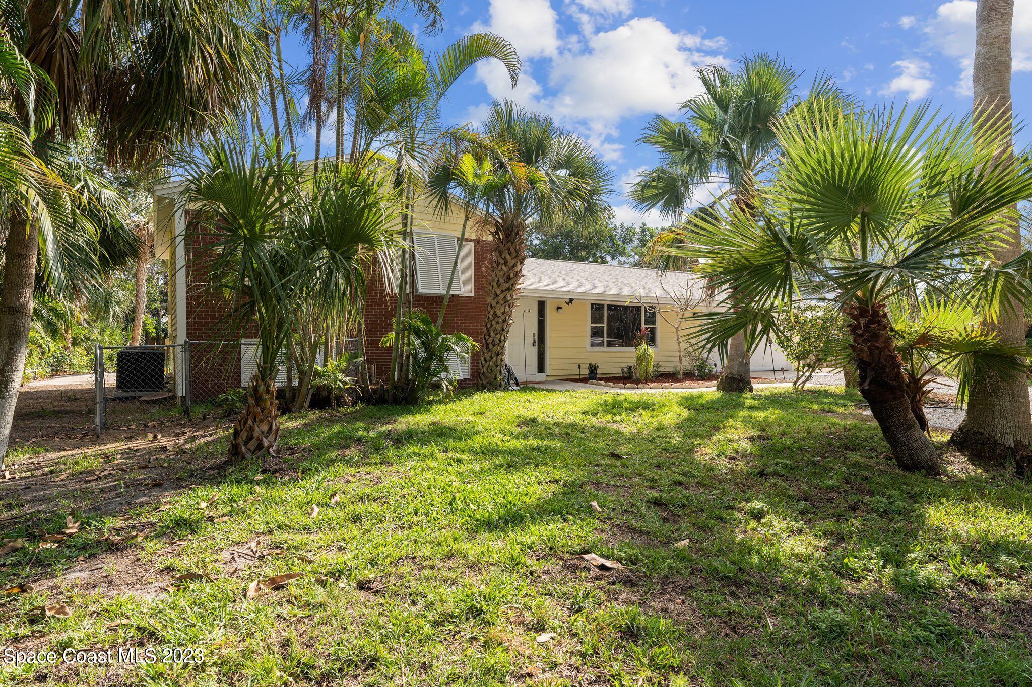 2007 Oak Street Melbourne Beach, FL 32951 - Photo 21 of 26 a view of a house with a yard