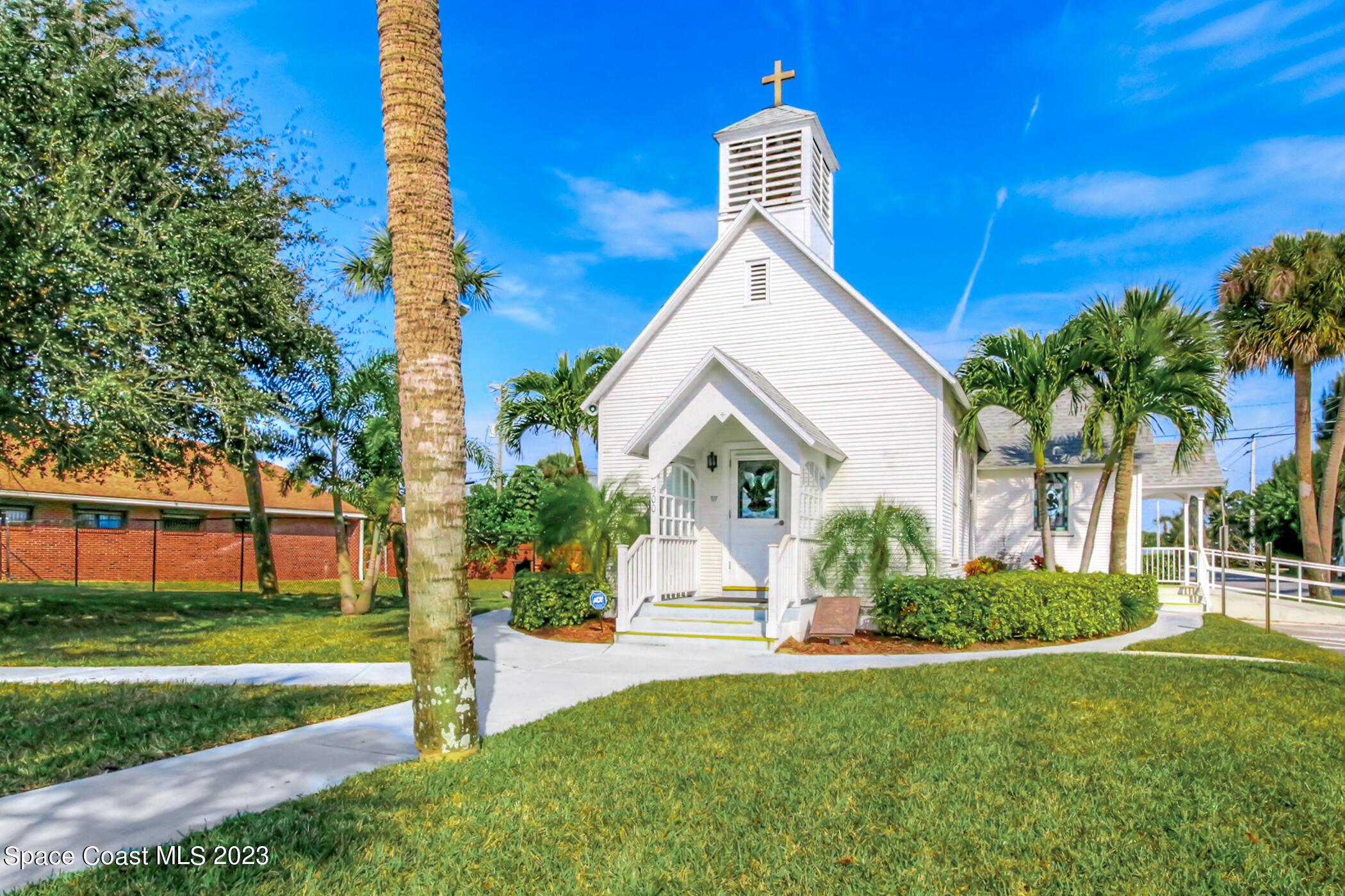 2007 Oak Street Melbourne Beach, FL 32951 - Photo 24 of 26 a view of a house with a yard and potted plants