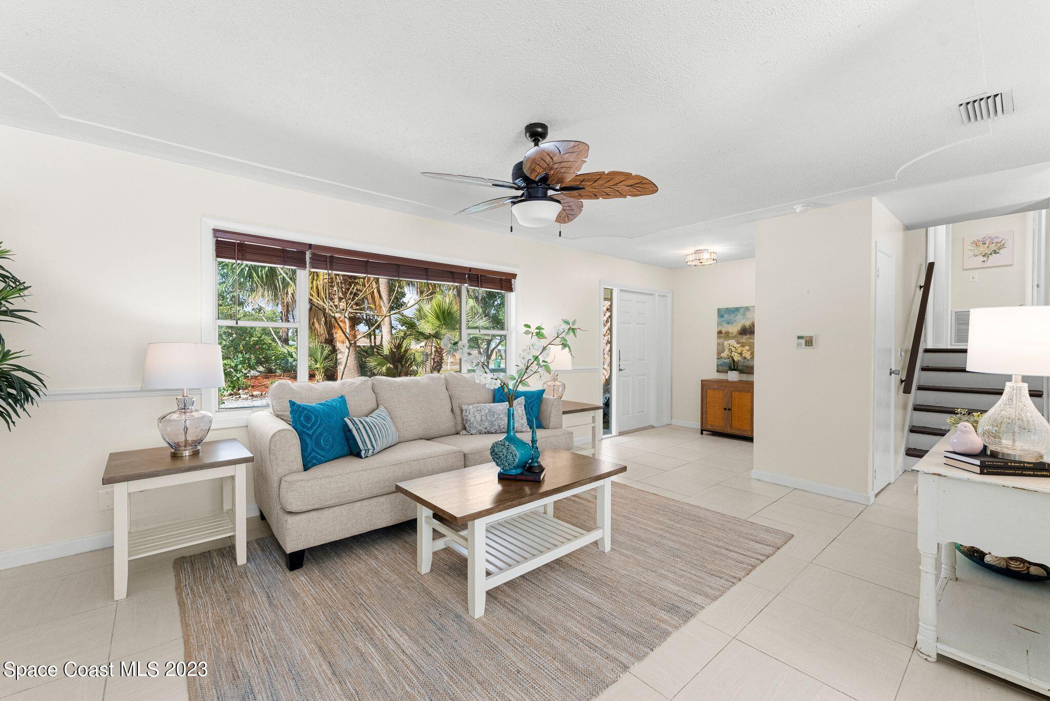 2007 Oak Street Melbourne Beach, FL 32951 - Photo 4 of 26 a living room with furniture and wooden floor