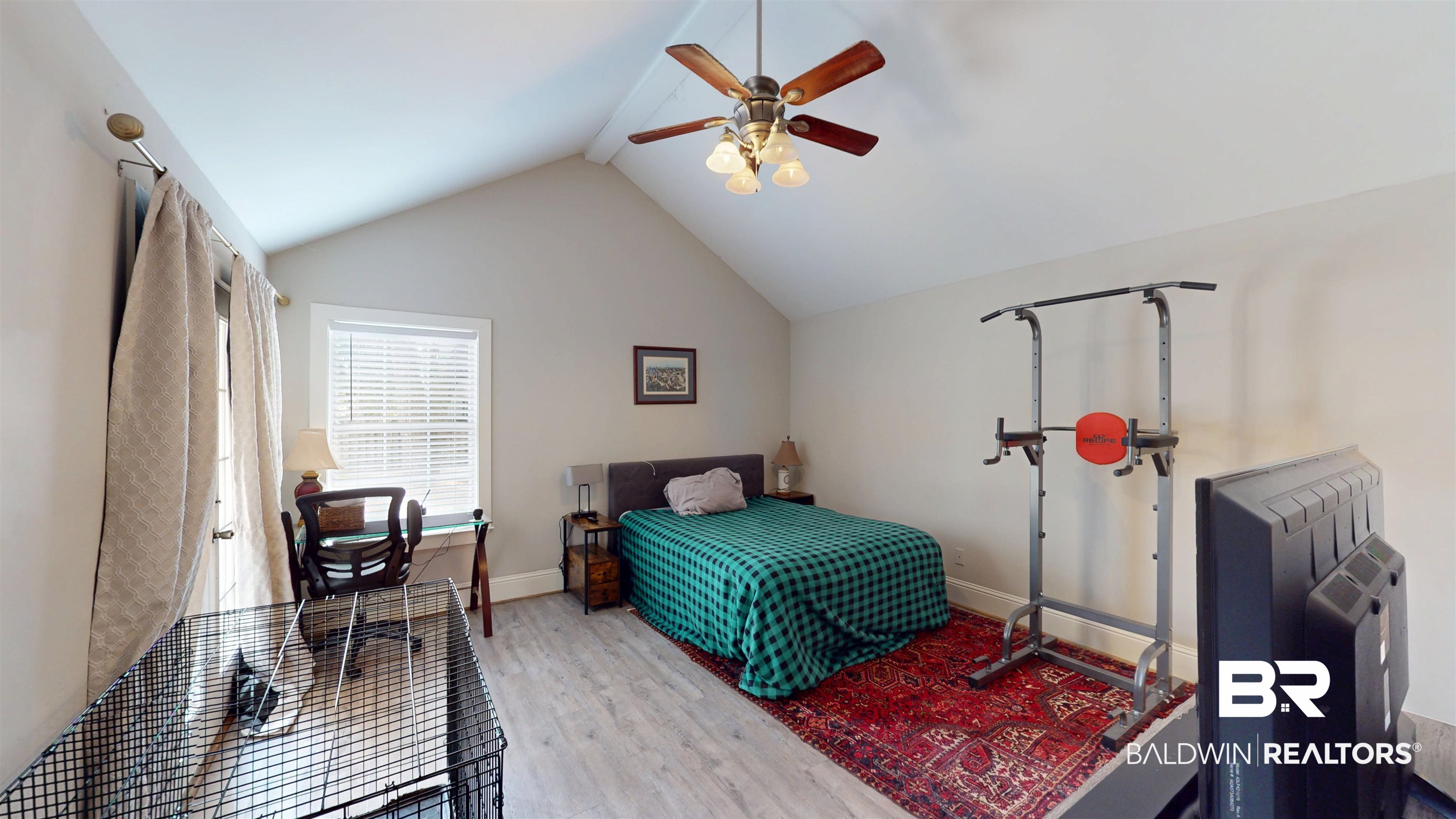 51 Bishop Lane South Mobile, AL 36608 - Photo 12 of 19 Bedroom with lofted ceiling, light wood-type flooring, and a ceiling fan