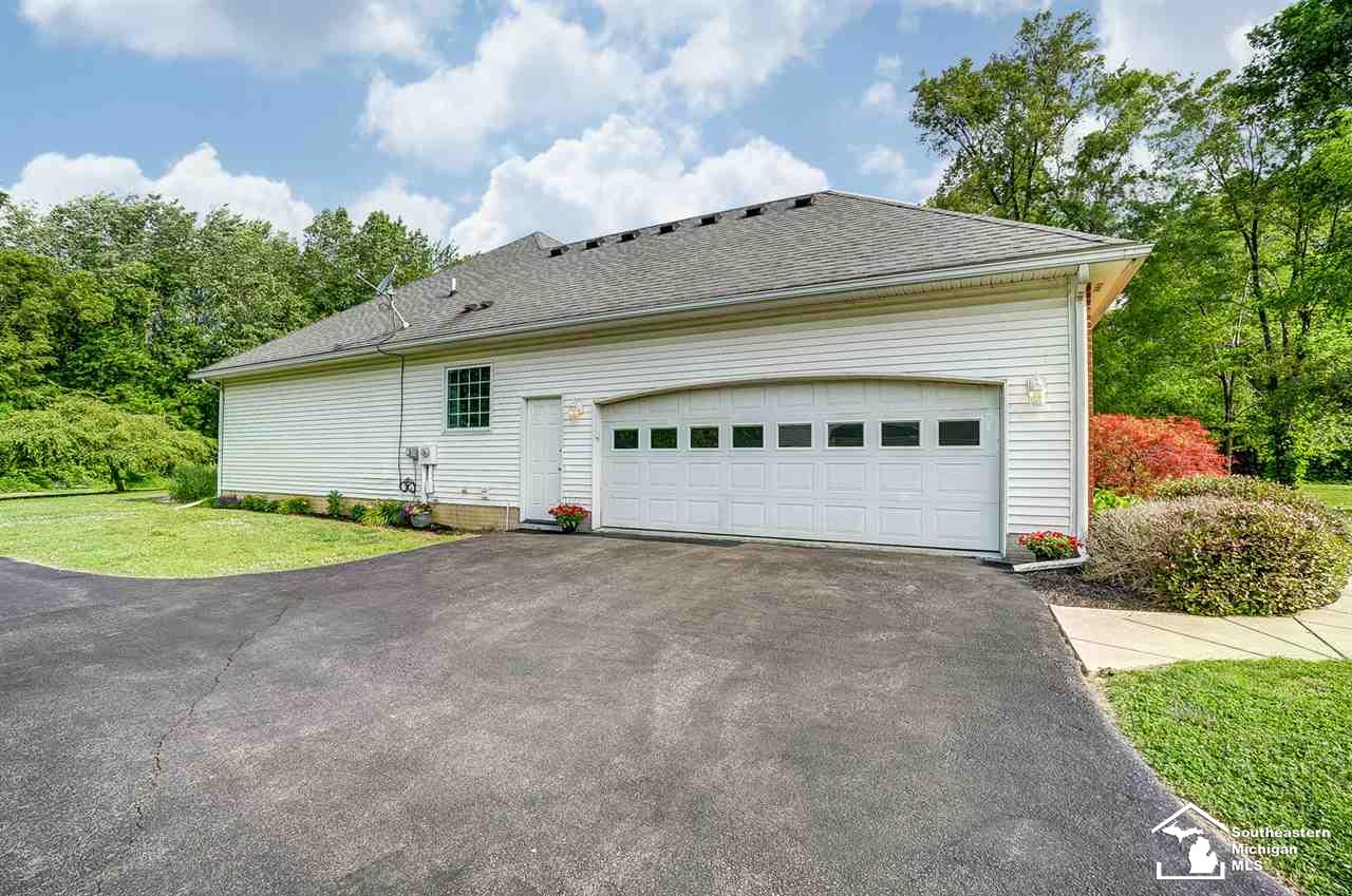6475 Douglas Road Lambertville, MI 48144 - Photo 39 of 39 Side entry garage features 2.5 parking spaces, service door, utility sink, attic storage and full house generator hook up.