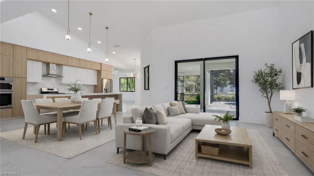 730 29th Street Southwest Naples, FL 34117 - Photo 11 of 50 Virtually Staged Living area with recessed lighting and vaulted ceiling