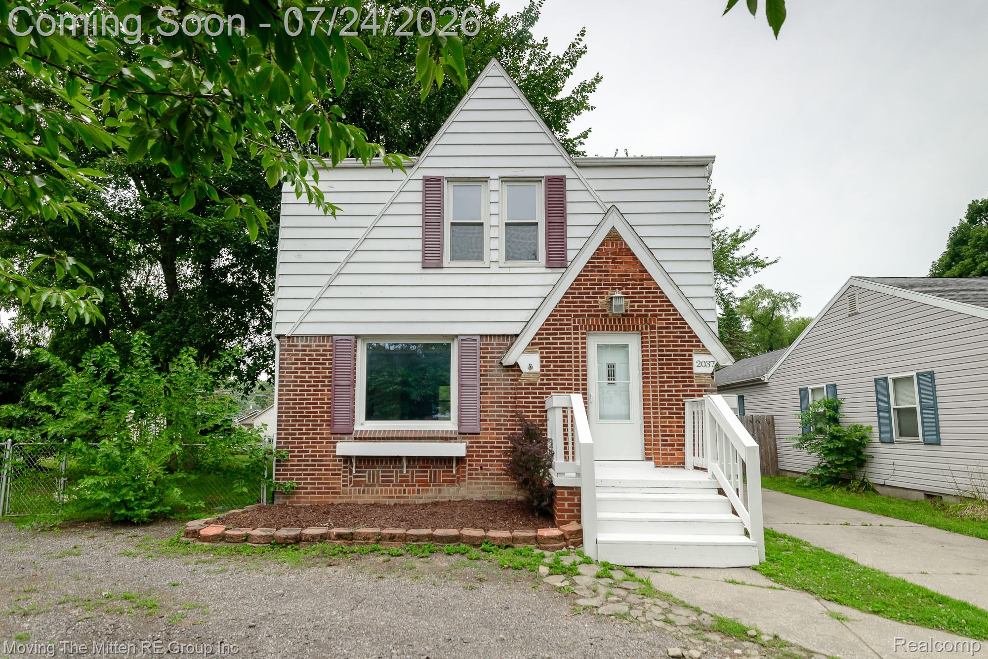 2037 Vivian Road Monroe, MI 48162 - Photo 1 of 39 Traditional-style residence featuring a prominent front gable and a brick facade