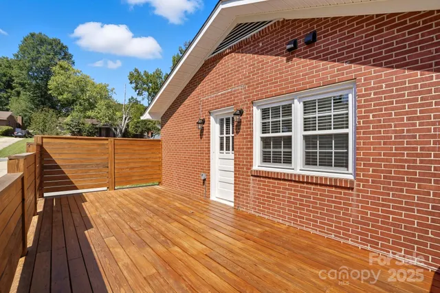 a view of wooden deck with a yard
