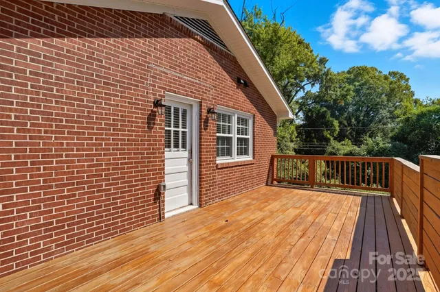 a view of balcony with wooden floor