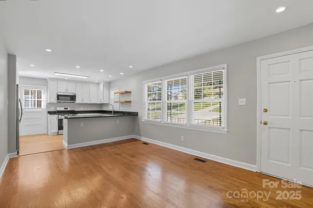 a kitchen with a refrigerator and window