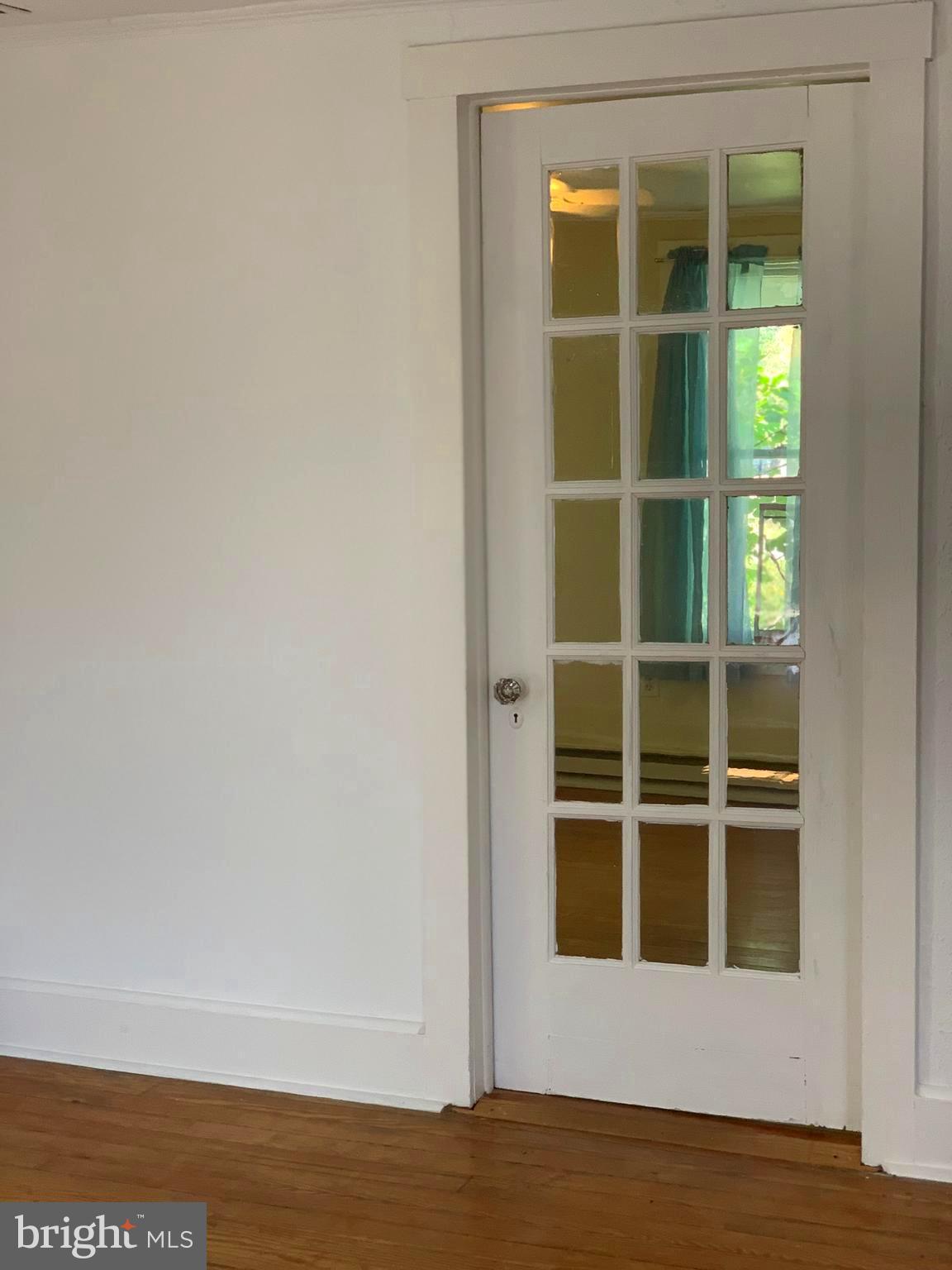 8645 Sewell Point Road Wittman, MD 21676 - Photo 13 of 22 French door into Den/ bedroom