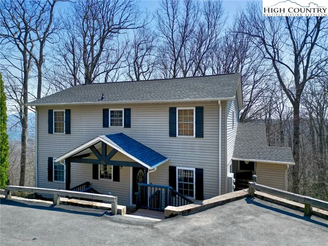 a front view of a house with garage