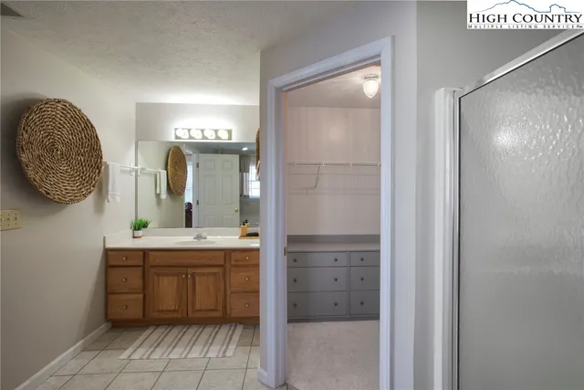 a bathroom with a bathtub and shower