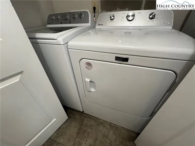 a view of balcony with furniture