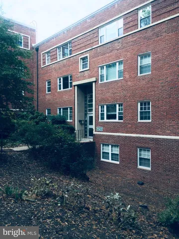 a view of a building with a yard