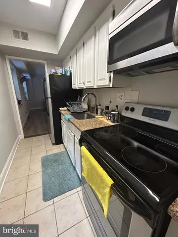 a kitchen with a stove and a sink