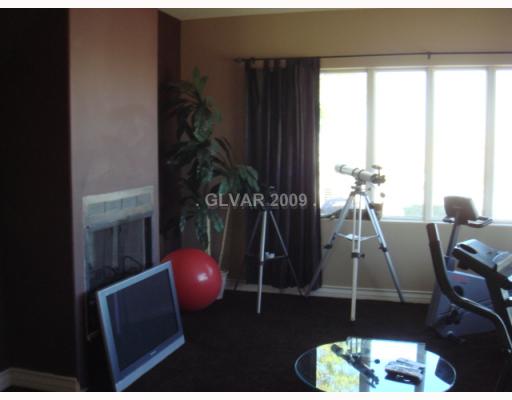 Living Room. Formal living room includes gas fireplace and pameramic views with crank roll out windows