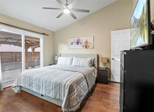 a bedroom with a large bed and a window