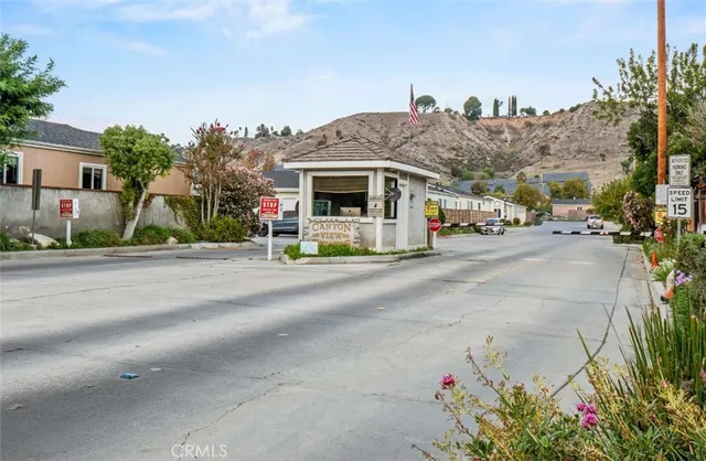 a front view of a house with a yard and a garage